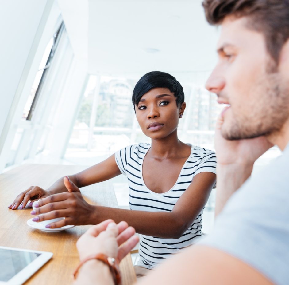 demo-attachment-307-Businesswoman-and-smiling-businessman-discussing-work-in-restaurant@2x